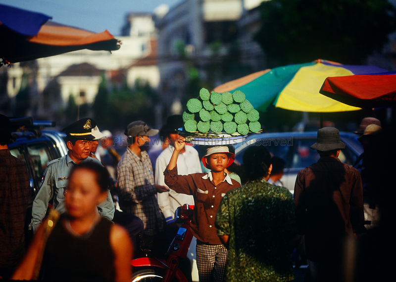 Busy market street scene Phnom Penh Cambodia