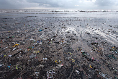 Trash covers Juhu Beach, Mumbai, India.