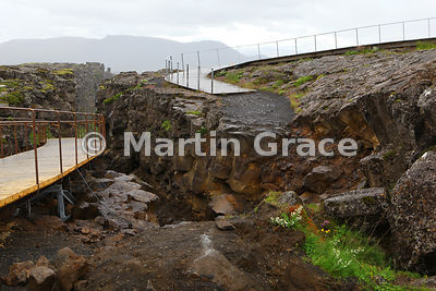 Rift and collapsed footpath on the edge of the North American tectonic plate at Thingvellir National Park, demonstrating the continuing dynamic nature of tectonic plate movement