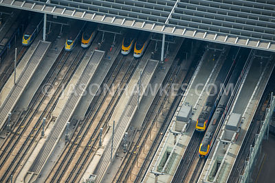 Aerial view of London, close up of railway lines and platforms.