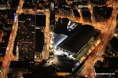 night aerial photograph of the Beetham Tower / Hilton Hotel and the GMEX / Manchester Central Convention Complex Manchester