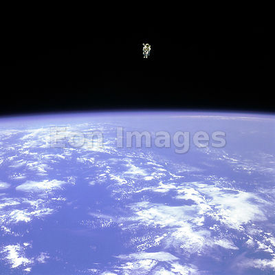 Astronaut with jetpack maneuvers in space