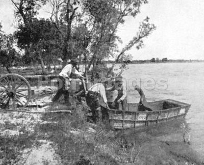 Pioneers in Ezra Meeker group launch schooner on river