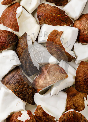 Fresh coconut pieces background close-up