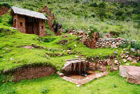 Ceremonial fountain and building in Inca site of Huchuy Qosqo, Cusco Region, Peru