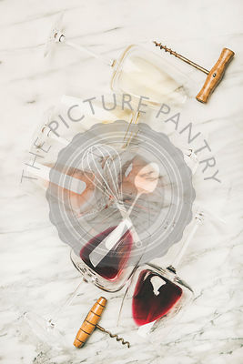 Red, rose and white wine in glasses and corkscrews