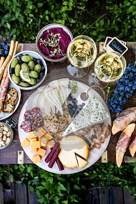 Meat and Cheese Platter served with wine outdoors