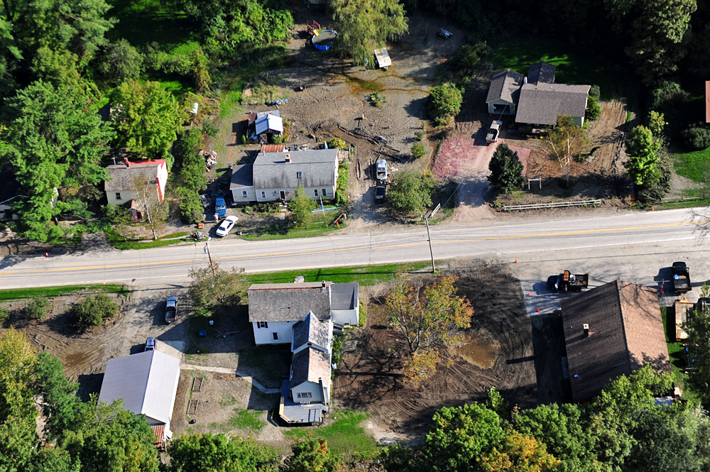 With river silt surrounding their homes in Pawlet, VT residents work to
