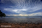 Sunset on the ocean-side coastline of Peucang Island [java_0068]