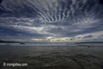 Sunset on the ocean-side coastline of Peucang Island [java_0077]