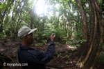 Ranger using a camera phone on patrol [java_0736]