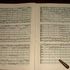 625596_sheet_music_score_and_conductors_baton_medium