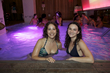 brunette curlies enjoy the pool at the curly pool party - Medium hair styles