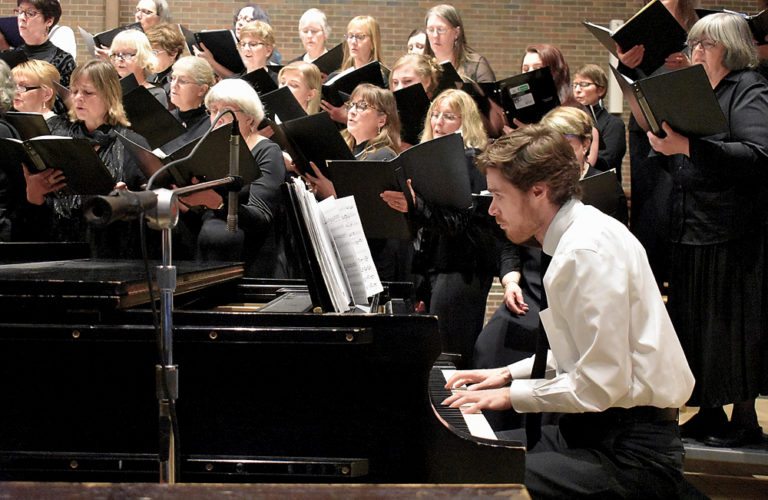 Drew Benware plays piano during the Northern Lights Choir’s winter concert at St. Bernard’s Church in Saranac Lake. The crowd erupted in ceremonious applause after his rendition of Joseph Haydn’s “The Heavens Are Telling.”
(Enterprise photo — Griffin Kelly)