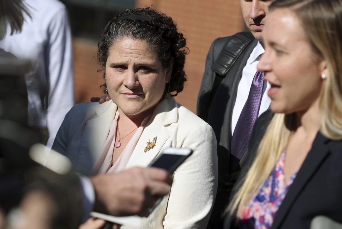 ASSOCIATED PRESS
University of Virginia administrator Nicole Eramo, left, listens to attorney Libby Locke, right, speak with the media outside the federal courthouse in Charlottesville, Va., on Friday. A federal jury on Friday found Rolling Stone magazine, its publisher and a reporter defamed Eramo in a discredited story about gang rape at a fraternity house of the university.