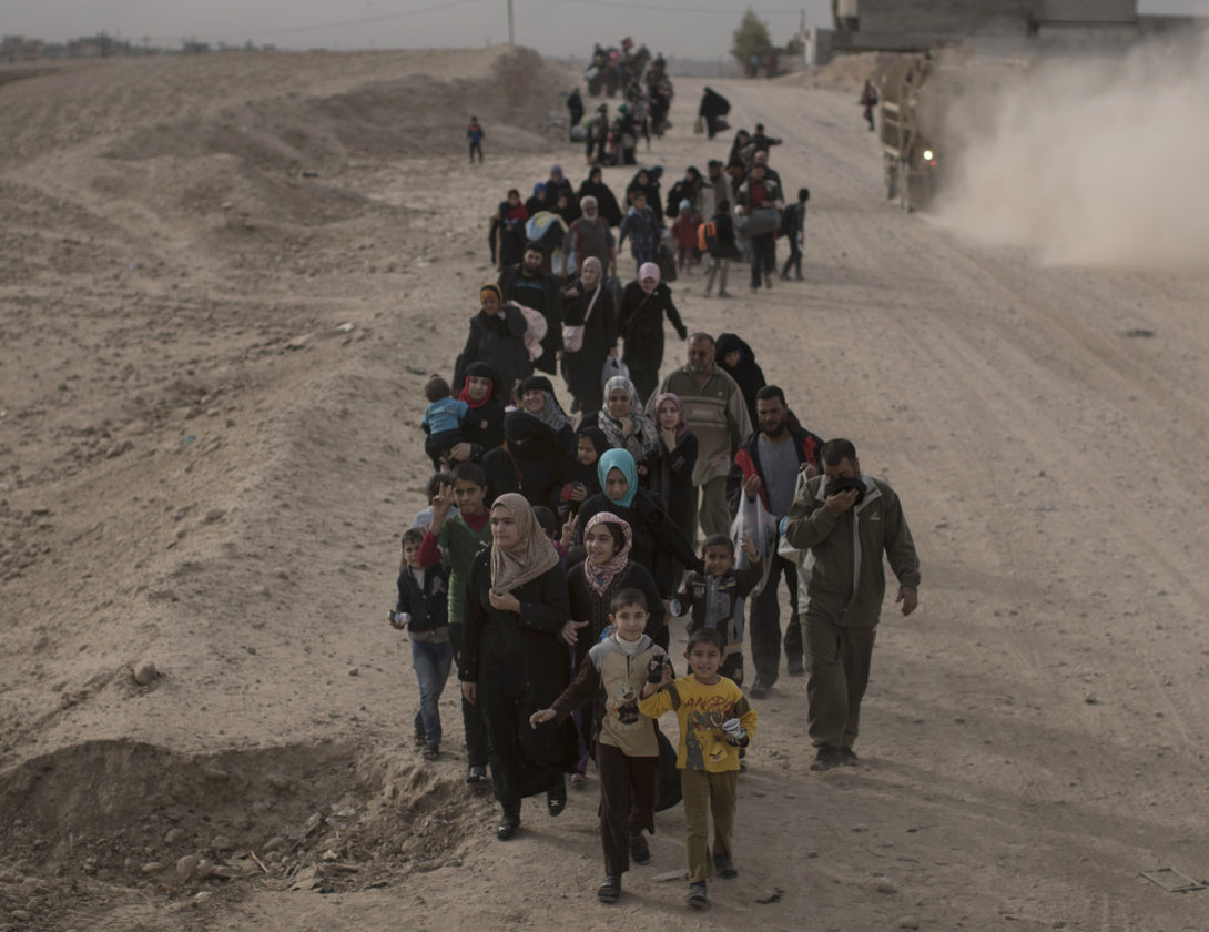 ASSOCIATED PRESS
Internally displaced people flee fighting between Iraqi forces and Islamic State militants on a road in eastern Mosul, Iraq, on Nov. 15.