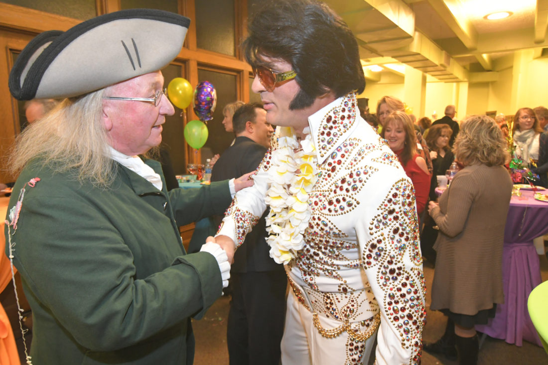 MARK NANCE/Sun-Gazette
A Benjamin Franklin impersonator, left, and an Elvis Presley impersonator meet up during the Williamsport/Lycoming Chamber of Commerce’s PM Exchange at the Williamsport Sun-Gazette on Thursday evening. The pair were on hand to celebrate the newspaper's 215th anniversary.