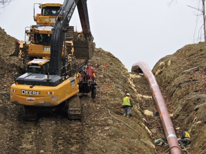 Photo by Casey Junkins
Natural gas pipeliners continue working at sites throughout the Upper Ohio Valley, including this one along W.Va. 2 near McMechen.