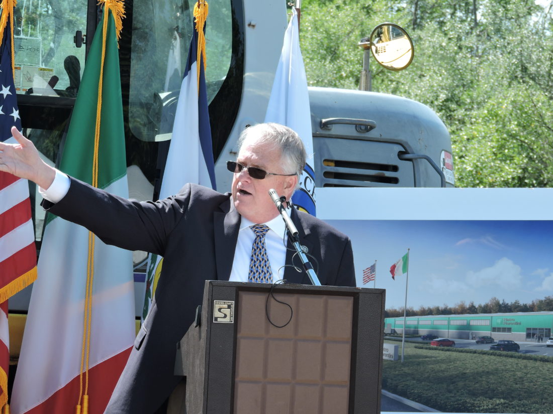 Dave Watkins, president of Pietro Fiorentini USA, addresses the crowd gathered in the Three Springs Business Park Friday prior to the ceremonial groundbreaking for the company's new Weirton facility. The factory will be the company's first permanent operation in the United States. -- Craig Howell