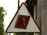 sign with notebook and pen