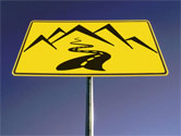 sign of wavy road going uphill