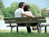 couple relaxing on park bench