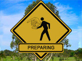 sign with person holding books and the word preparing