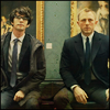 Q and Bond sitting in a museum