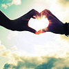 Heart hands in sunlight, by boundary