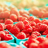 stock photo of several baskets of raspberries