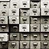 black and white card catalog with some drawers pulled out