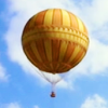 Orange and yellow hot air balloon against blue sky