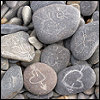 rounded pebbles with lovehearts chalked on them