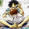Luffy, reading a book with his feet.