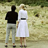 two white women with their backs to the camera.