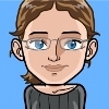 avatar of a bespectacled female looking at you