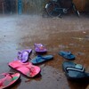 flip flops abandoned in the mud during a rain storm