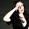 Kat Dennings looking up her hand shielding eyes