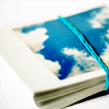 a polaroid of a cloudy blue sky