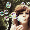 brunette blowing bubbles