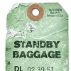 a luggage tag saying the word "baggage"