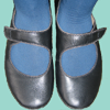 Feet in blue tights and black mary janes