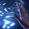Sam Carter's hand touching Stargate's eventhorizon