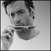 Hugh Jackman putting on shades