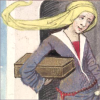Medieval woman in a long dress carrying a box