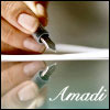 Brown fingers hold a fountain pen poised to write