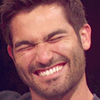 Hoechlin wrinkles his nose when he laughs