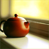 a teapot on a windowledge
