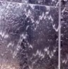 water running down vertical fountain