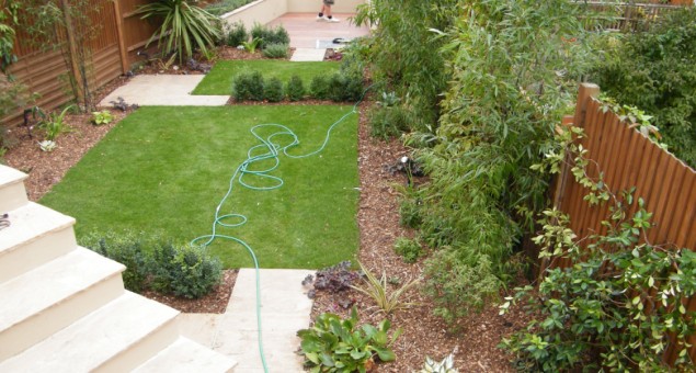 The back garden was given a contemporary makeover with a design which helps counteract the long, narrow shape by introducing a series of squares and rectangles, making the garden appear wider. 